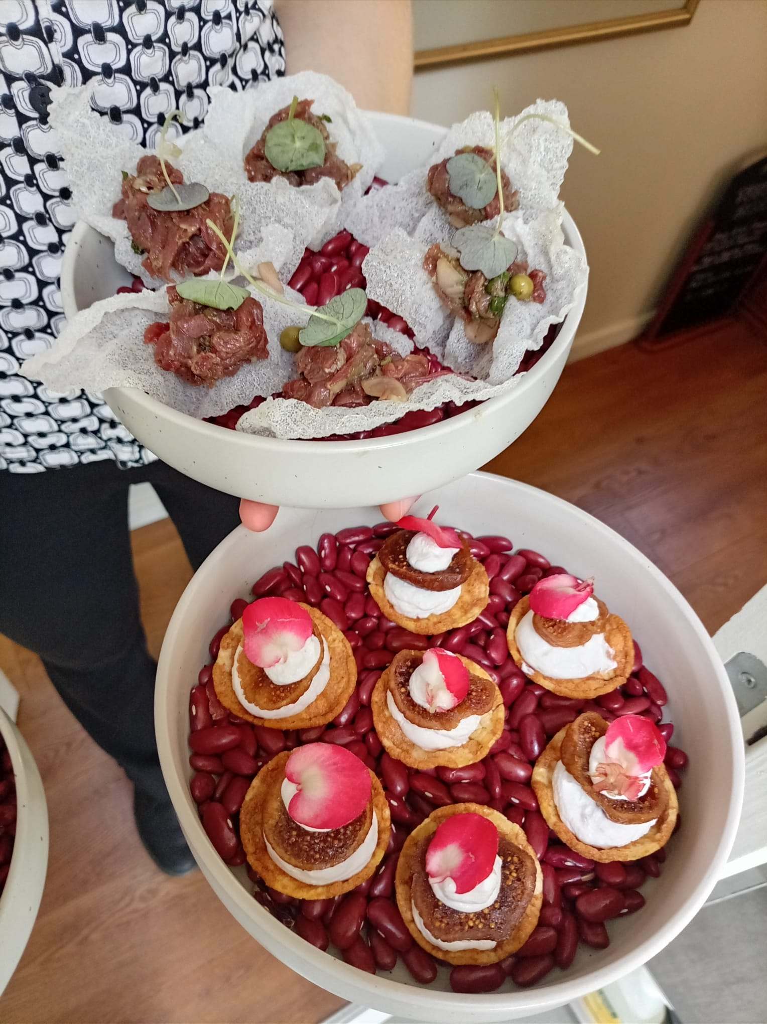 Reception bites: cream and radish tartlets on a bed of red beans, and crispy bites.